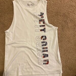 3 under Armour tops and matching sports bra.